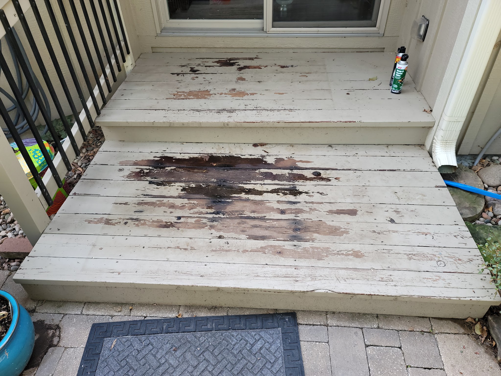 Worn painted porch steps before repair